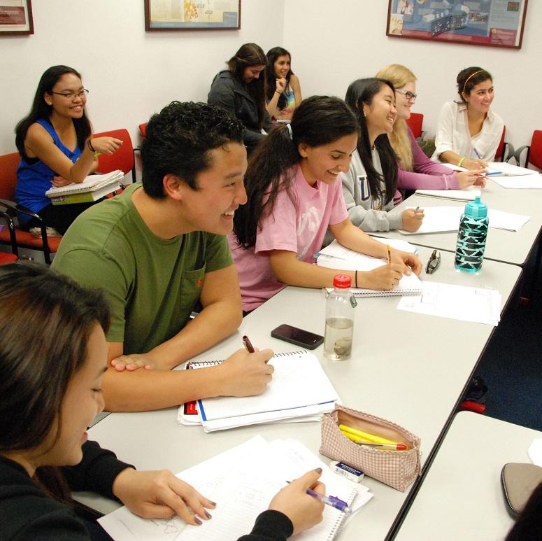 Photo of students sitting in UCLA Classroom smiling